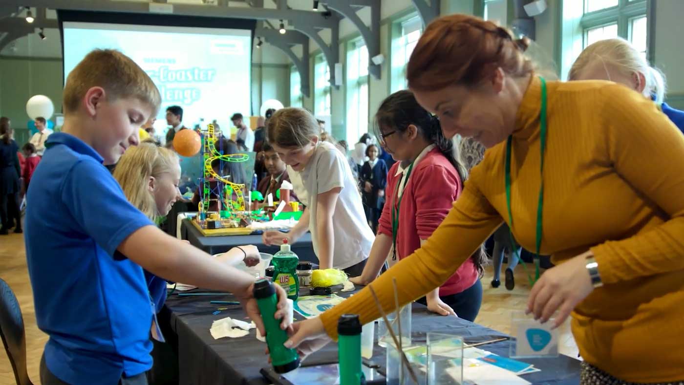 School children getting hands-on experience with simple science experiments